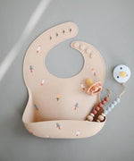 Load image into Gallery viewer, Printed Mushie Silicone Bib Singapore Rockets
